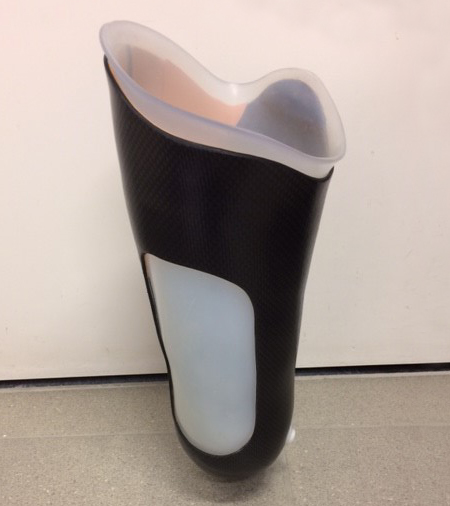 Prosthetic socket with cut-out walls and a flexible inner socket.