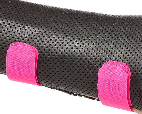 Black orthosis with pink hook-and-loop strapping