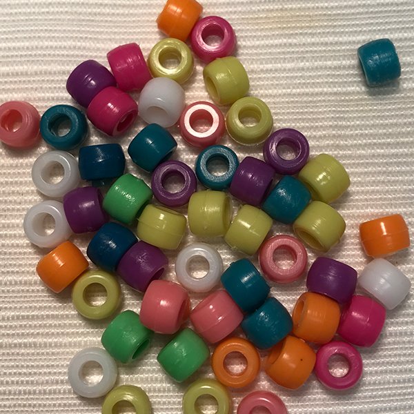 Colorful beads for the decoration of an orthosis